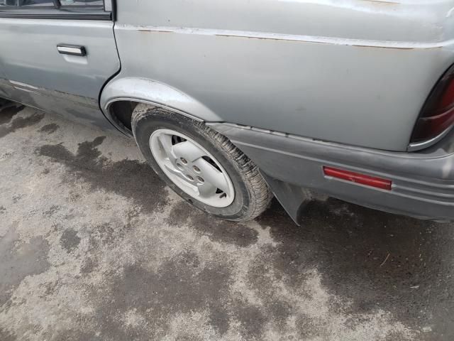 1G1JC5449R7165516 - 1994 CHEVROLET CAVALIER V GRAY photo 9