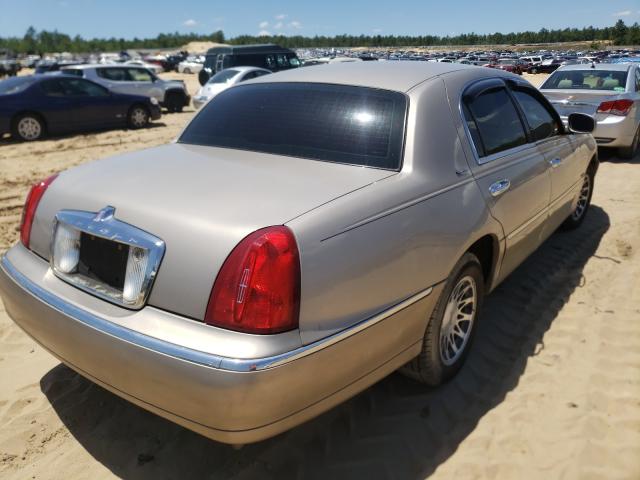 1LNHM82W9YY857899 - 2000 LINCOLN TOWN CAR S SILVER photo 4