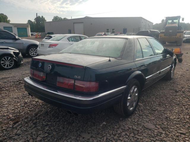 1G6KS52Y2VU830307 - 1997 CADILLAC SEDAN GREEN photo 4