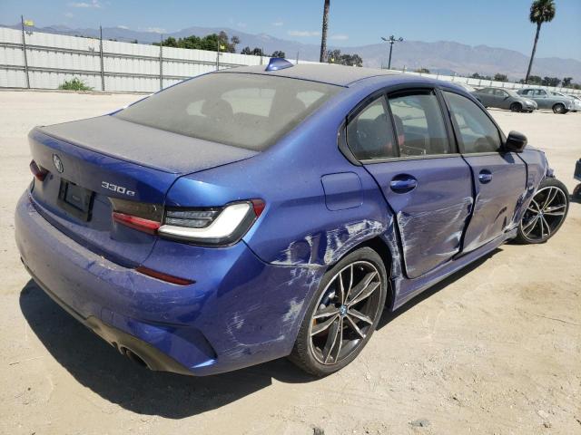 WBA5P7C09NFL64585 - 2022 BMW 330E BLUE photo 4