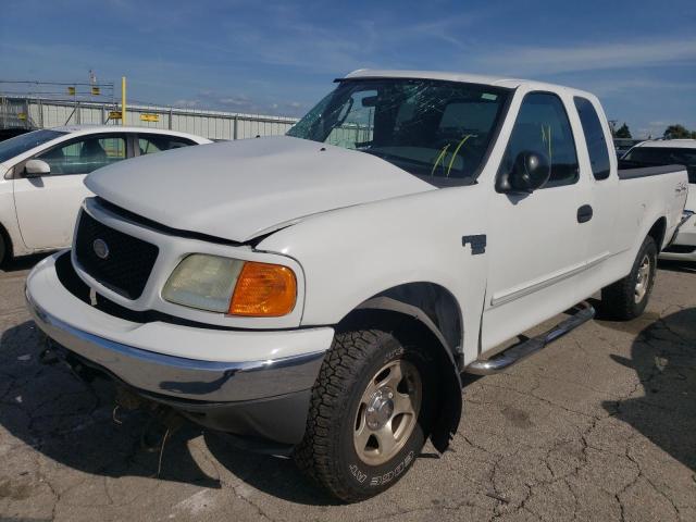 2FTRX18W44CA08571 - 2004 FORD F-150 HERI WHITE photo 2