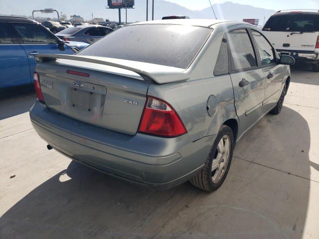 1FAFP34N35W121810 - 2005 FORD FOCUS ZX4 TEAL photo 4