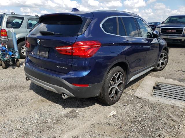 WBXHT3C58K5L90518 - 2019 BMW X1 XDRIVE2 BLUE photo 4