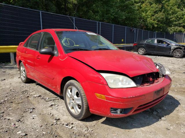 1FAHP38Z05W310730 - 2005 FORD FOCUS ZX4 RED photo 1