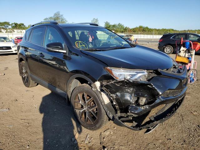 2T3JFREV4JW757640 - 2018 TOYOTA RAV4 SE BLACK photo 1