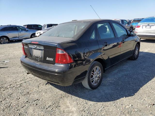 1FAHP34N47W170039 - 2007 FORD FOCUS ZX4 BLACK photo 4