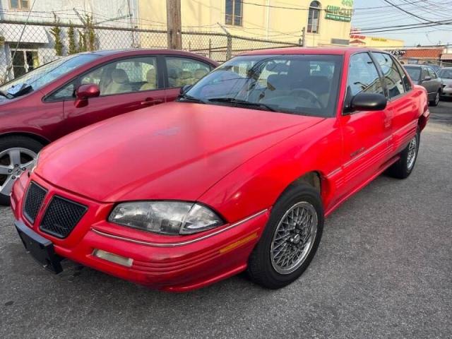 1G2NE54N4PM568513 - 1993 PONTIAC GRAND AM S RED photo 2