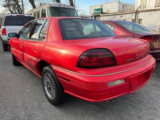 1G2NE54N4PM568513 - 1993 PONTIAC GRAND AM S RED photo 3