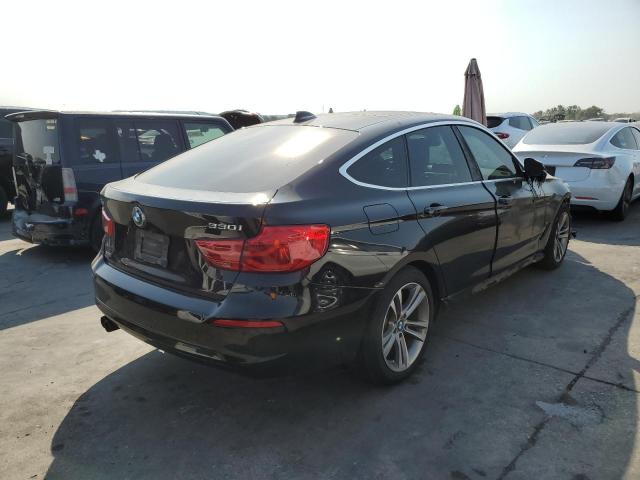 WBA8Z9C57JB219738 - 2018 BMW 330 XIGT BLACK photo 4