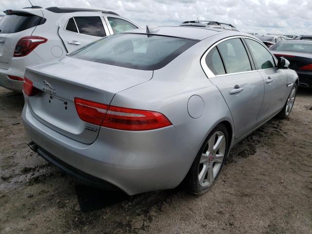 SAJAK4FN4JCP18242 - 2018 JAGUAR XE PRESTIG SILVER photo 4