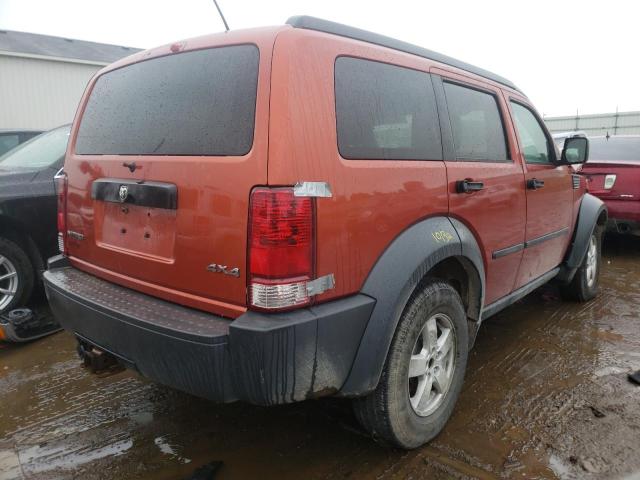 1D8GU28K17W555438 - 2007 DODGE NITRO SXT ORANGE photo 4