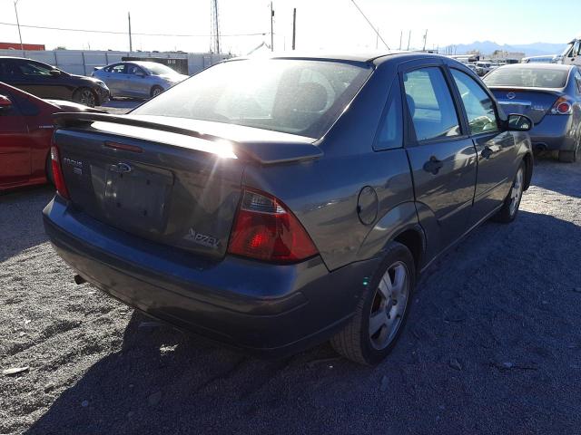 1FAHP34NX7W358077 - 2007 FORD FOCUS ZX4 GRAY photo 4