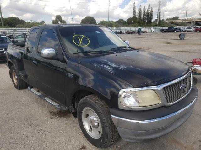 1FTZX07291KA62299 - 2001 FORD F150 BLACK photo 4