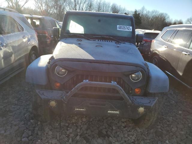 1C4BJWDG0CL235209 - 2012 JEEP WRANGLER U შავი ფოტო 5