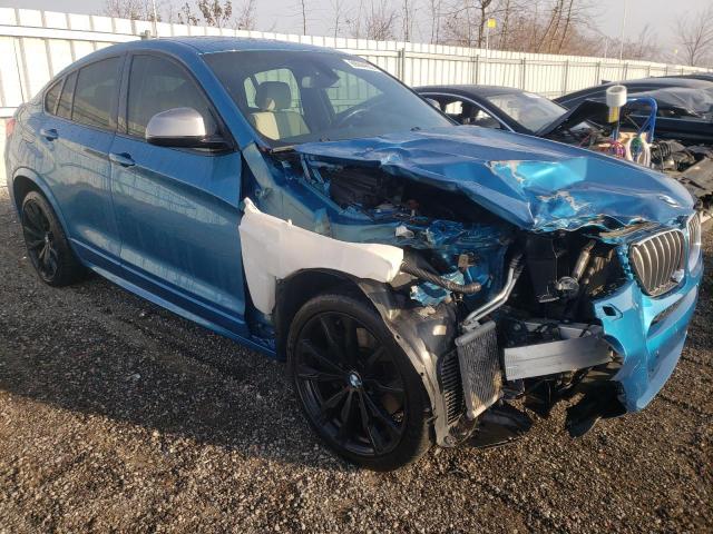 5UXXW7C56J0W64106 - 2018 BMW X4 XDRIVEM BLUE photo 4