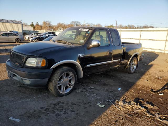 1FTZX17251NB50707 - 2001 FORD F150 BLACK photo 1