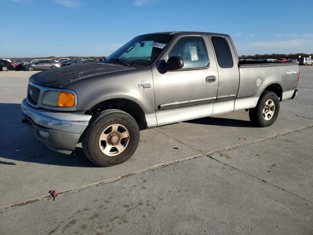 2FTRX18W04CA62837 - 2004 FORD F-150 HERI GRAY photo 1