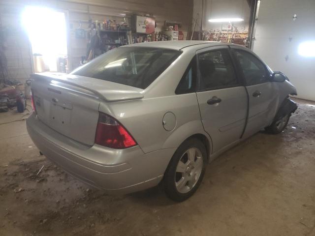 1FAHP34N17W327638 - 2007 FORD FOCUS ZX4 SILVER photo 4