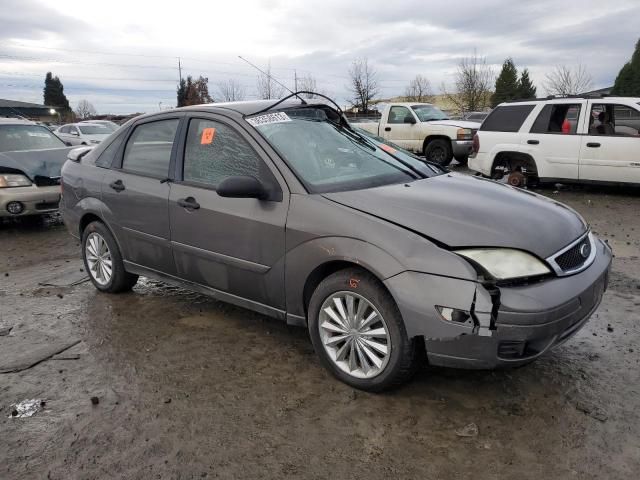 1FAFP34N75W285139 - 2006 FORD FOCUS ZX4 GRAY photo 4