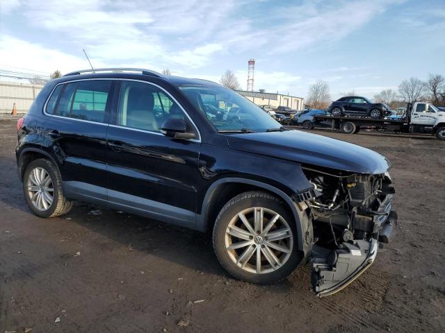 WVGBV7AX3BW500955 - 2011 VOLKSWAGEN TIGUAN S BLACK photo 4