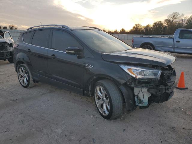 1FMCU0J93HUB88690 - 2017 FORD ESCAPE TITANIUM BLACK photo 4