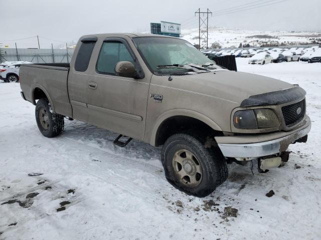 1FTRX18L72NB90540 - 2002 FORD F150 TAN photo 4