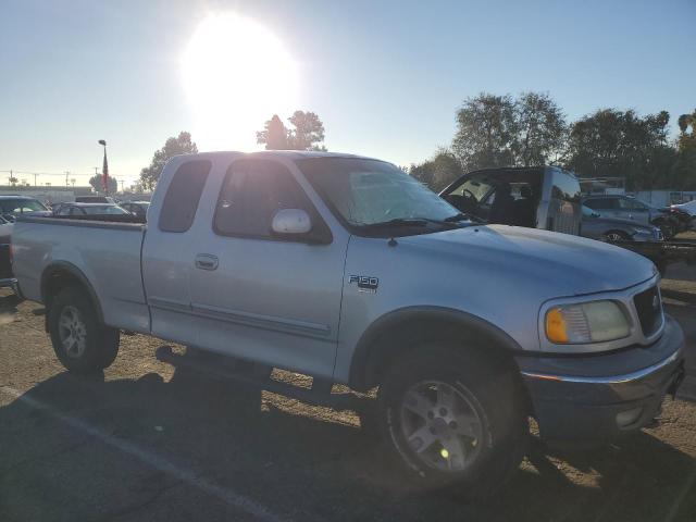 1FTRX18LX2NA85927 - 2002 FORD F150 SILVER photo 4