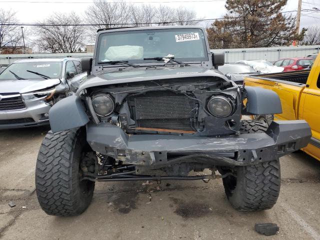1C4BJWDG4GL309446 - 2016 JEEP WRANGLER U SPORT ნაცრისფერი ფოტო 5