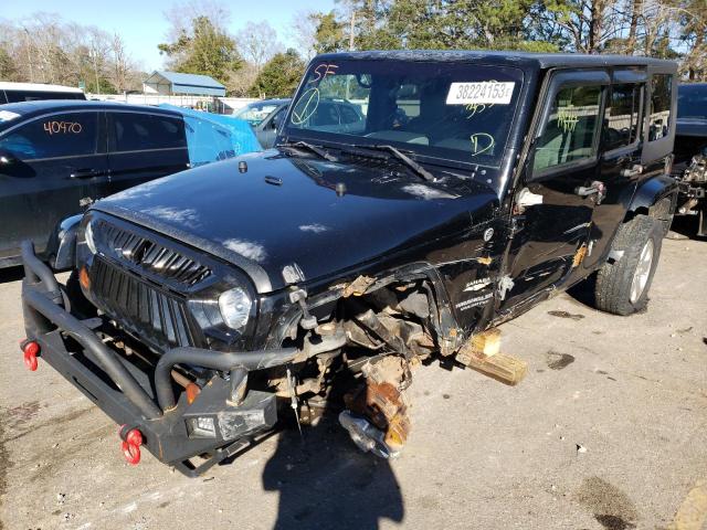 1J4GA59129L718689 - 2009 JEEP WRANGLER U SAHARA BLACK photo 1