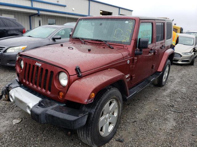 1J4HA5H12AL129622 - 2010 JEEP WRANGLER U SAHARA MAROON photo 1
