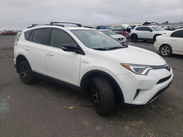 JTMJJREV9JD247991 - 2018 TOYOTA RAV4 HV SE WHITE photo 4