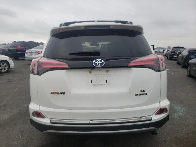 JTMJJREV9JD247991 - 2018 TOYOTA RAV4 HV SE WHITE photo 6