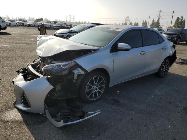 5YFBURHE3HP620439 - 2017 TOYOTA COROLLA L SILVER photo 1