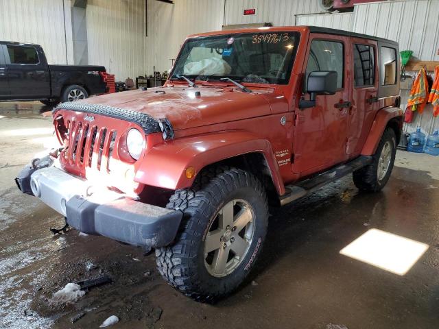 1J4GA59189L735643 - 2009 JEEP WRANGLER U SAHARA ORANGE photo 1