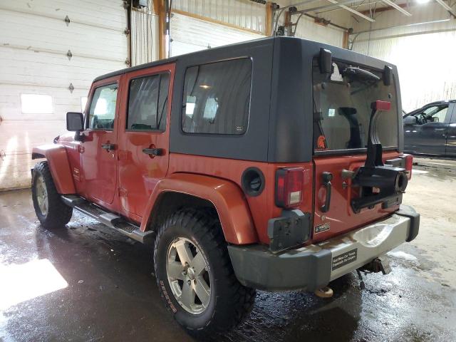 1J4GA59189L735643 - 2009 JEEP WRANGLER U SAHARA ORANGE photo 2