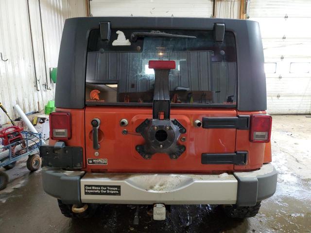 1J4GA59189L735643 - 2009 JEEP WRANGLER U SAHARA ORANGE photo 6