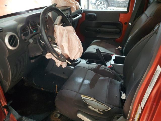 1J4GA59189L735643 - 2009 JEEP WRANGLER U SAHARA ORANGE photo 7