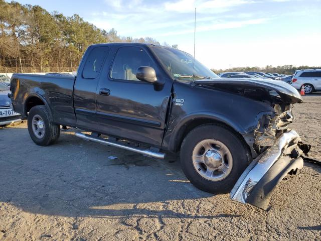 1FTRX17L32NB19322 - 2002 FORD F150 BLACK photo 4