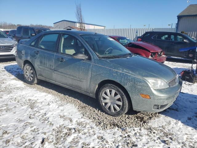 1FAHP34N96W106853 - 2006 FORD FOCUS ZX4 GRAY photo 4