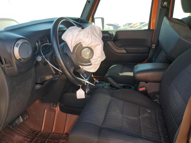 1J4BA3H15BL515818 - 2011 JEEP WRANGLER U SPORT Помаранчевий фото 7