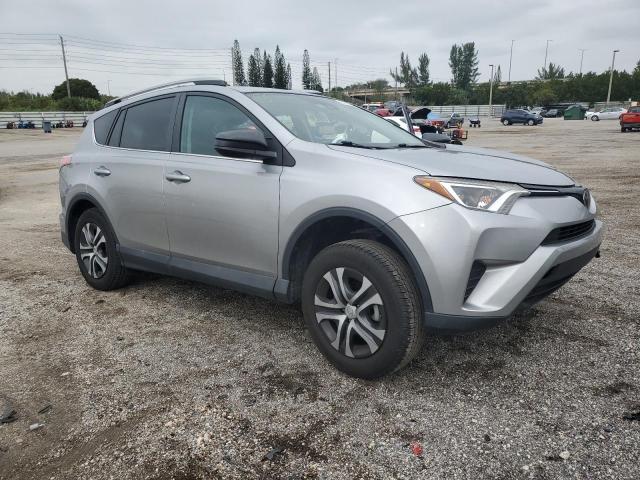 2T3ZFREV9HW362317 - 2017 TOYOTA RAV4 LE SILVER photo 4