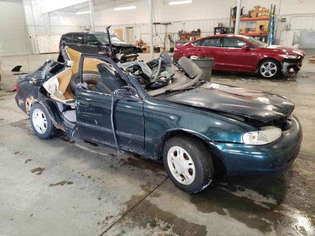 1Y1SK5284XZ402849 - 1999 CHEVROLET GEO PRIZM BASE GREEN photo 4