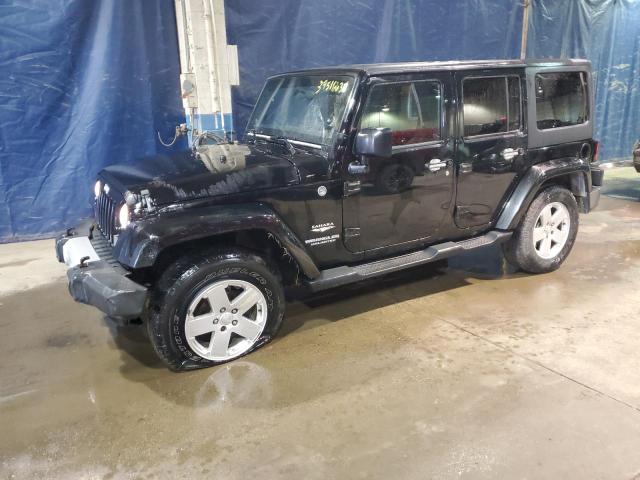 1J4BA5H18BL520510 - 2011 JEEP WRANGLER U SAHARA BLACK photo 1