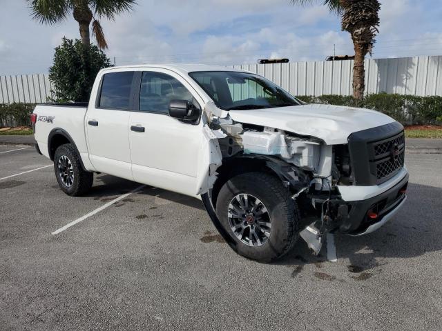 1N6AA1ED2PN105359 - 2023 NISSAN TITAN SV WHITE photo 4