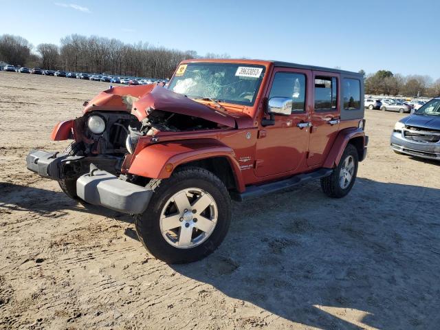 1J4GA59169L759018 - 2009 JEEP WRANGLER U SAHARA ORANGE photo 1