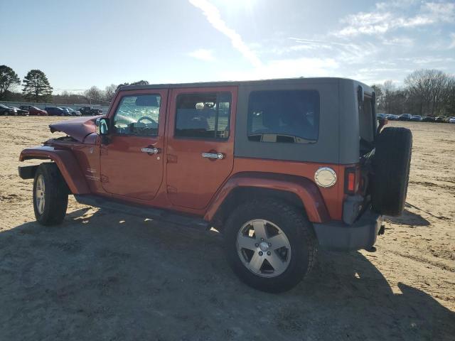 1J4GA59169L759018 - 2009 JEEP WRANGLER U SAHARA ORANGE photo 2