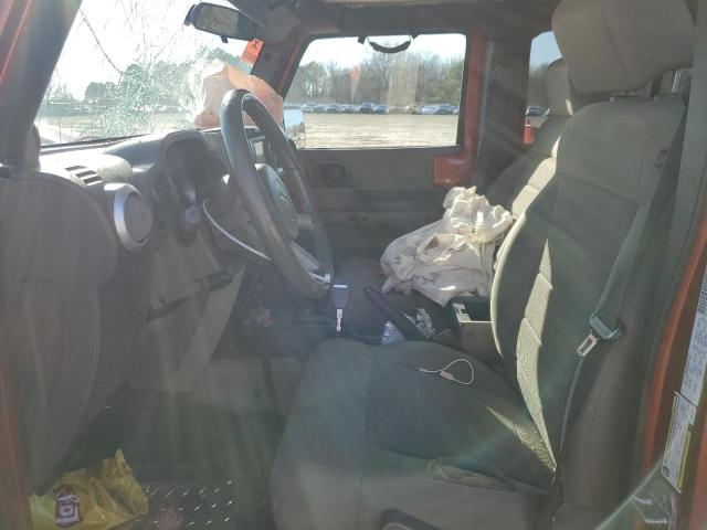 1J4GA59169L759018 - 2009 JEEP WRANGLER U SAHARA ORANGE photo 7