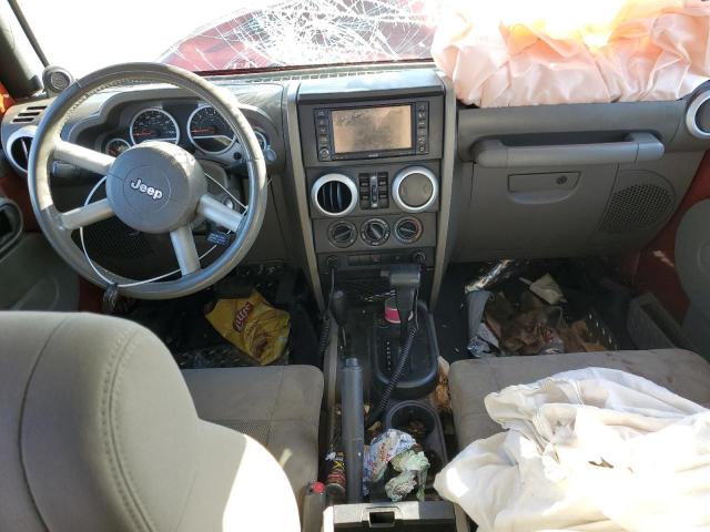 1J4GA59169L759018 - 2009 JEEP WRANGLER U SAHARA ORANGE photo 8