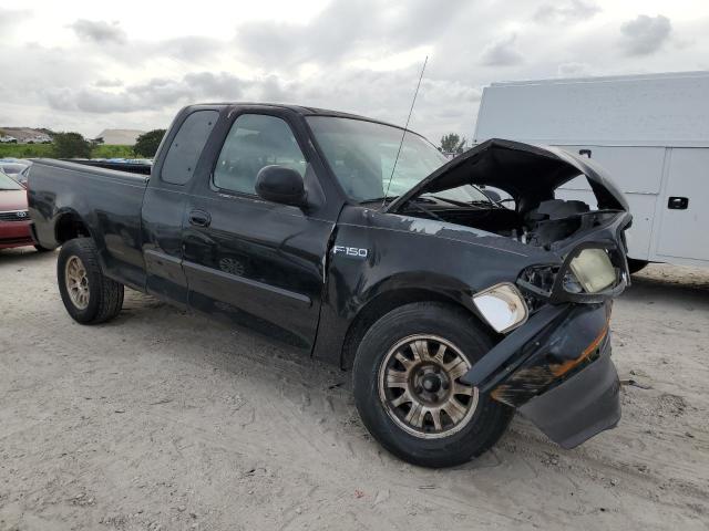 1FTRX17262NB79988 - 2002 FORD F150 BLACK photo 4