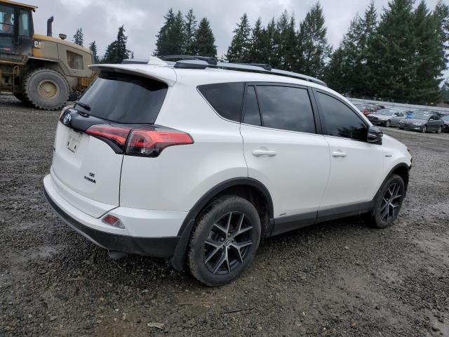 JTMJJREV8JD250610 - 2018 TOYOTA RAV4 HV SE WHITE photo 3